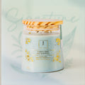 eco friendly Candle with decorative label on a light background Jade's essence 