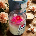Eco friendly candle gifting with 'I love Dad' message and floral design on a wooden surface with flowers.