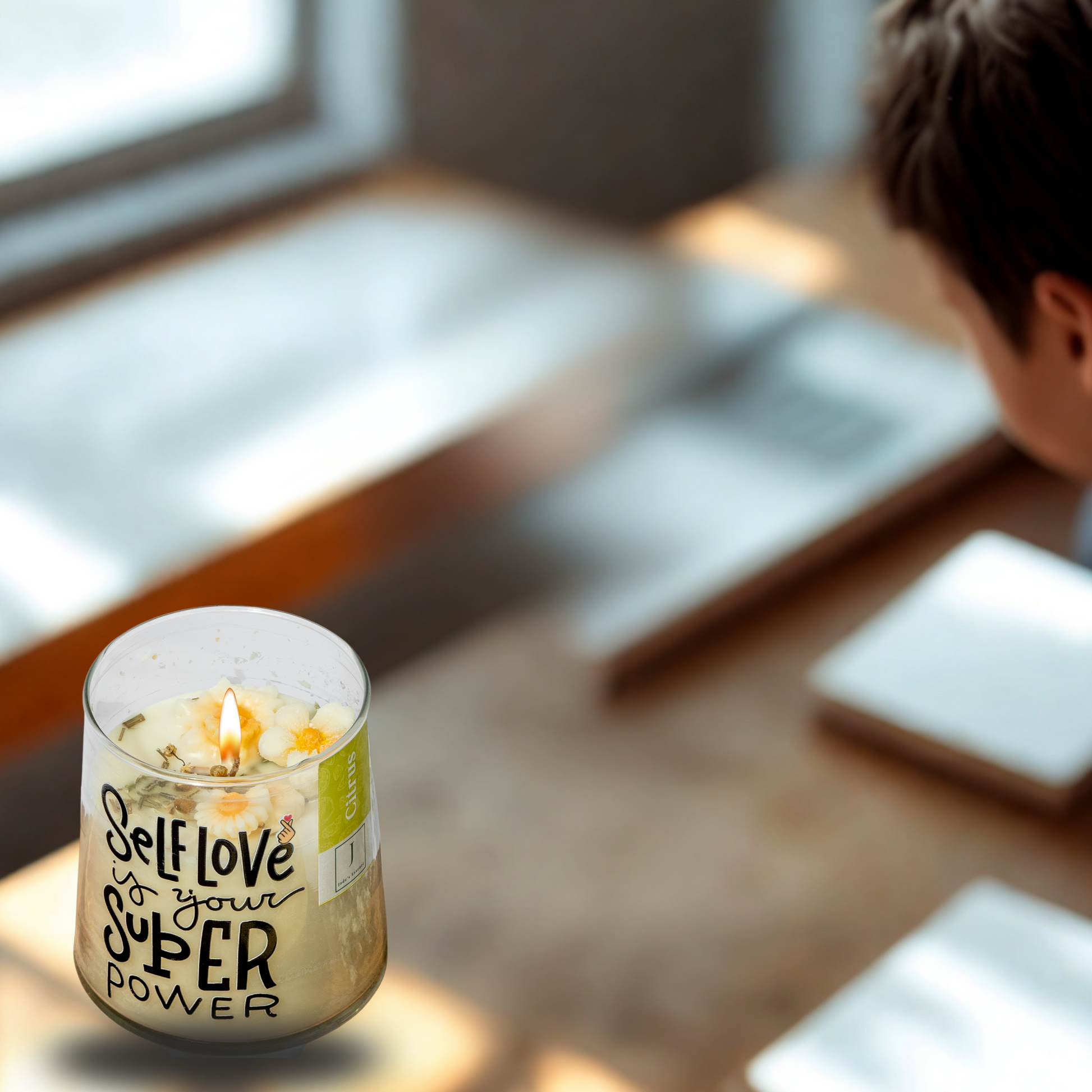 eco friendly Candle with 'Self love is your super power' text on a table by a window