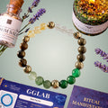 Beaded bracelet with stones on a light green background with GGLAB packaging and lavender flowers.