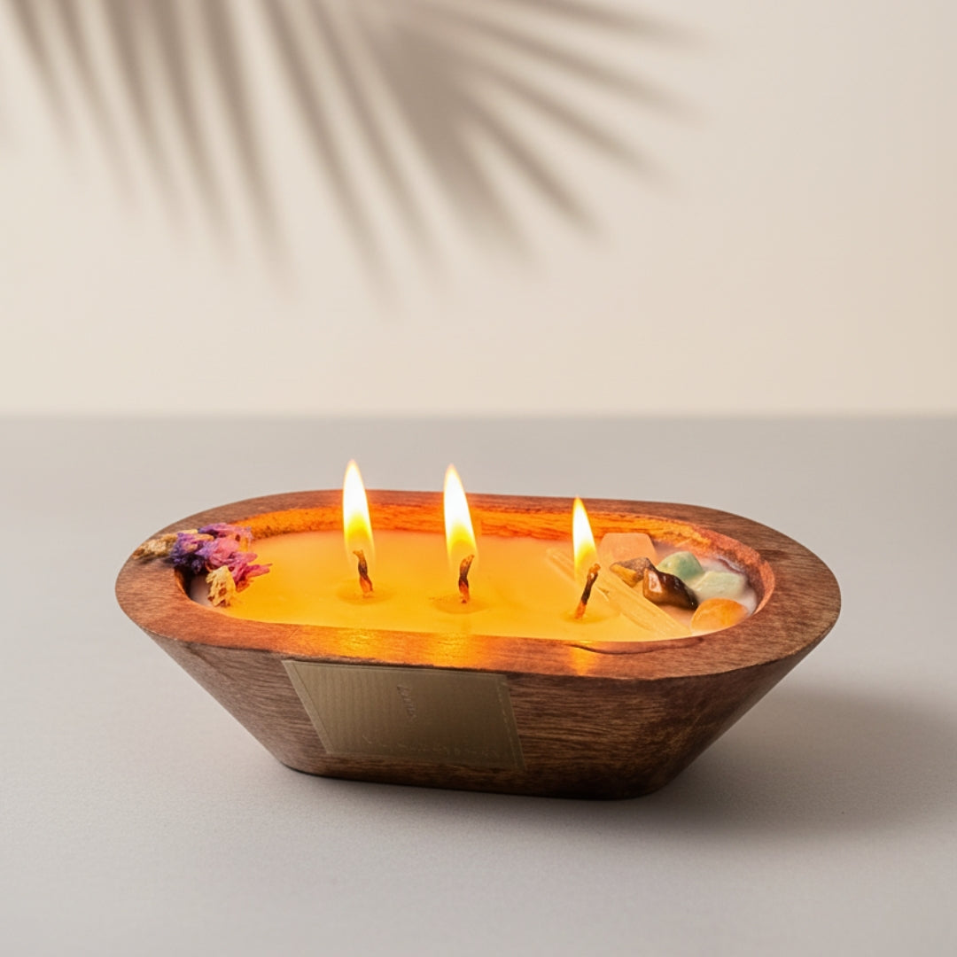Three-wick candle in a wooden holder on a neutral background