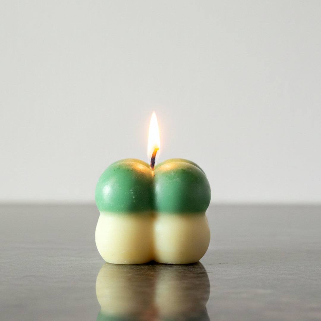 Two colorful candle designs on a neutral background