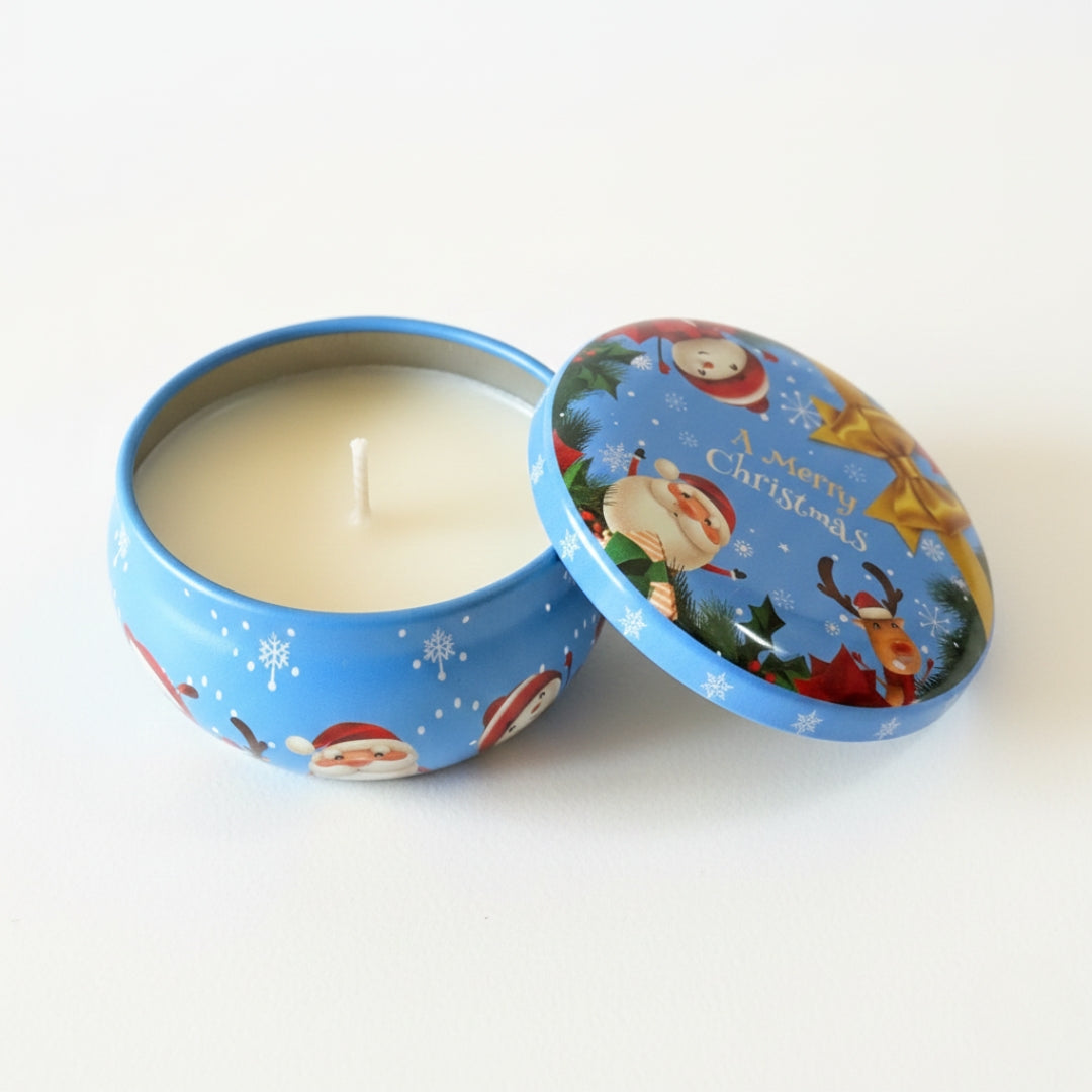 Christmas-themed candle in a tin with Santa Claus and reindeer design on a white background