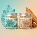 Two eco friendly candles with labels featuring natural elements and crystals on a gradient background