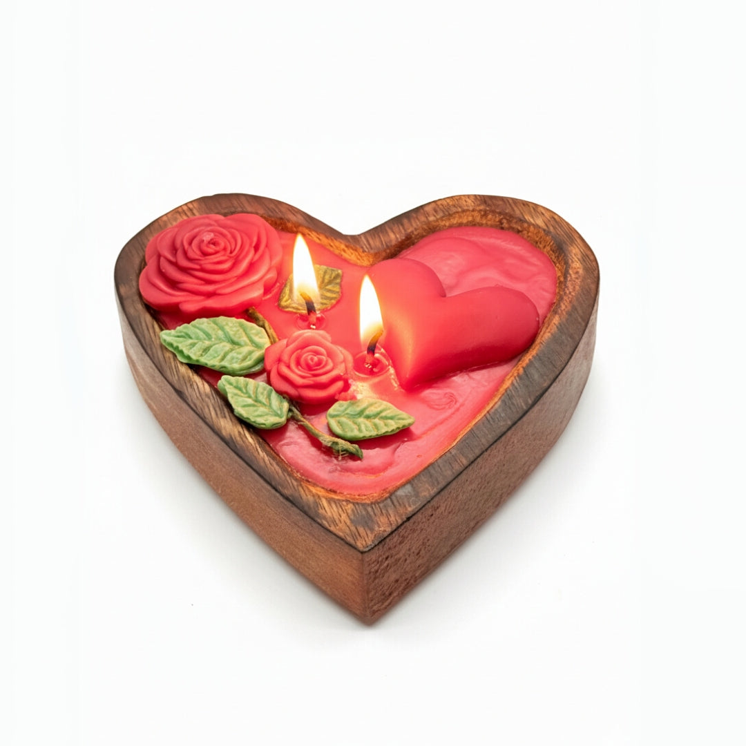 Heart-shaped wooden candle holder with red roses and a lit candle on a white background