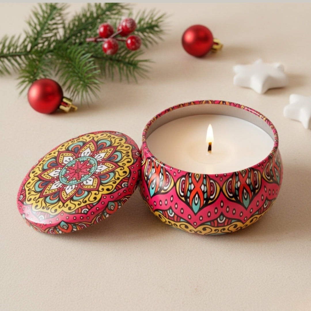 Decorative candle in a colorful tin with festive decorations on a beige surface