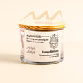 ecofriendly Candle in a glass jar with a wooden lid, featuring an Aquarius zodiac label on a beige background.