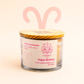 Ecofriendly Candle with Aries zodiac design on a light pink background